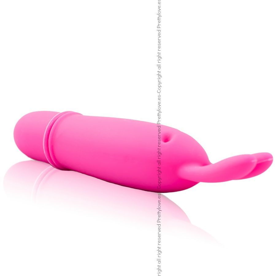 Vibratore coniglio rosa in silicone, sdraiato su un lato, con due orecchie e un'estremità arrotondata.