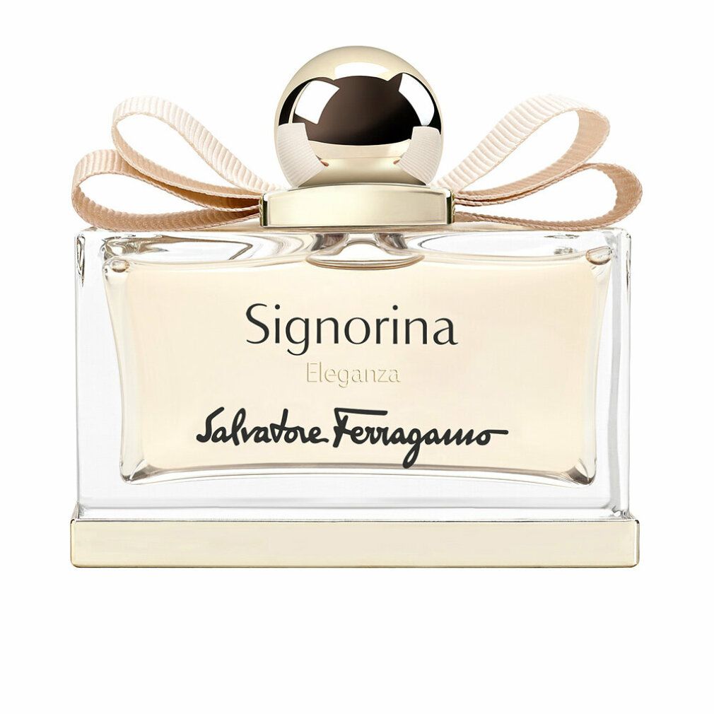 Flacone di profumo rettangolare con tappo e fiocco dorati. Scritta Signorina Eleganza e Salvatore Ferragamo.