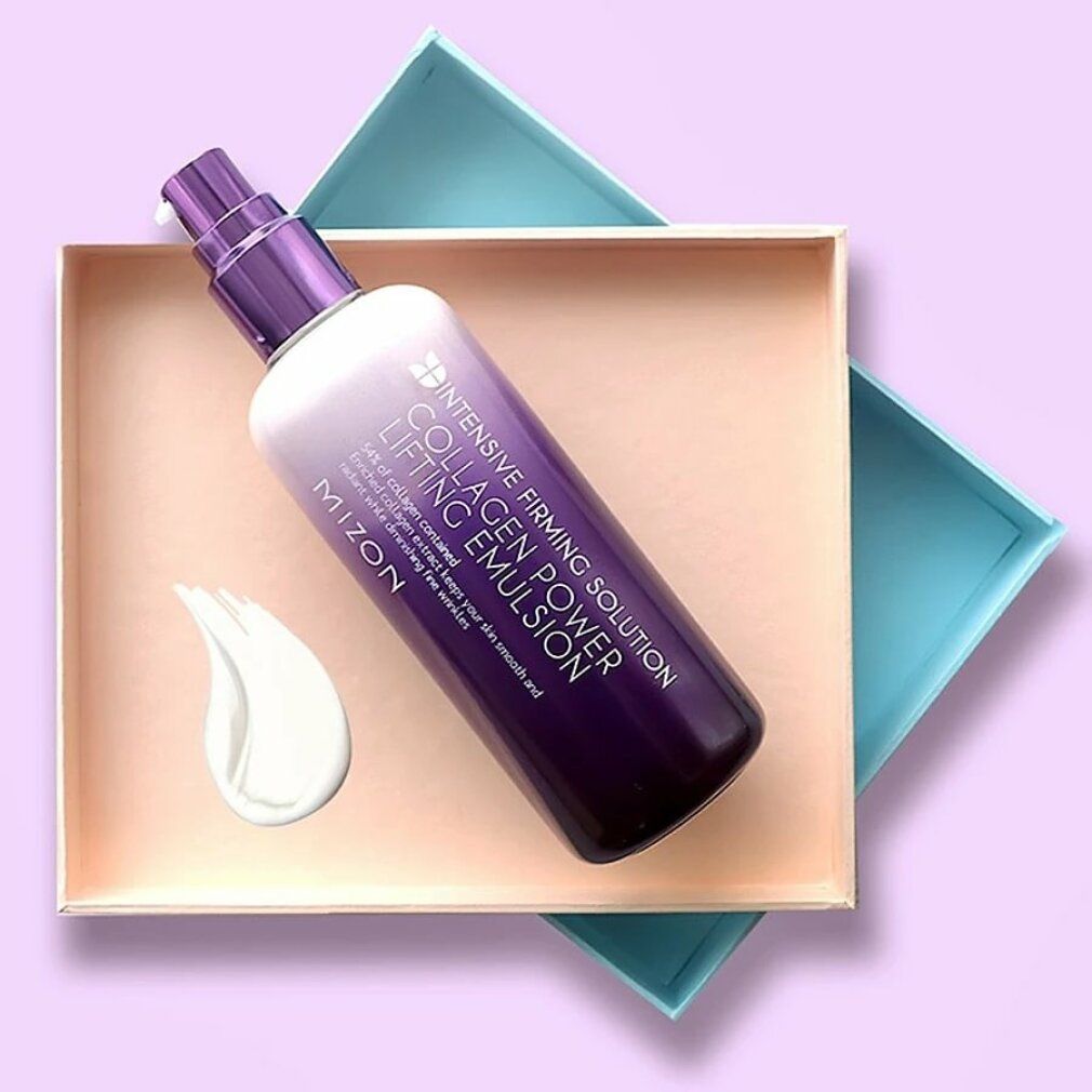 Flacone MIZON Collagen Power Lifting Emulsion in scatola. Prodotto e macchia di crema. Testo: Collagen Power Lifting Emulsion.