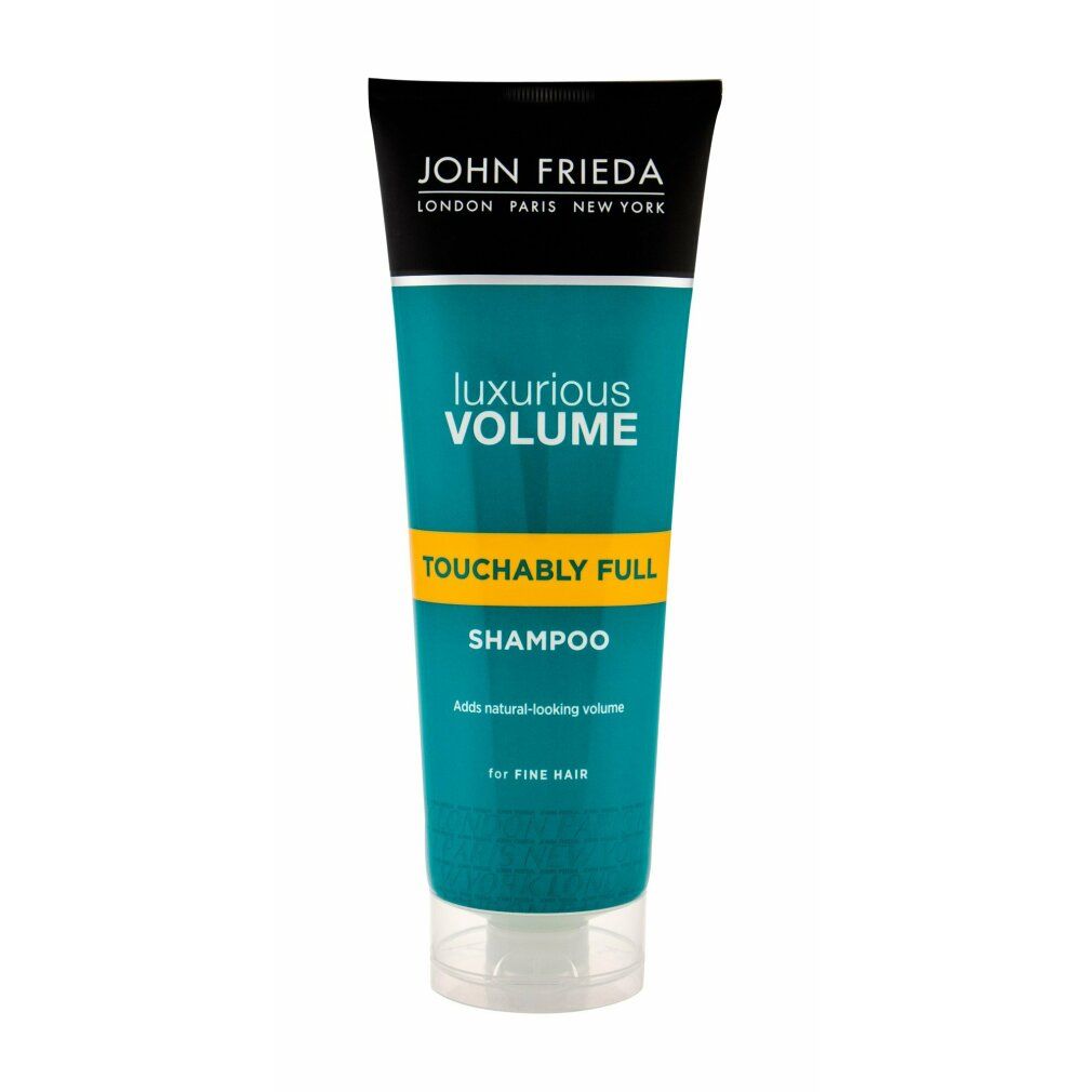 Tubo di shampoo con tappo nero e testo verde. Scritta: Luxurious Volume, Touchably Full, Shampoo. Per capelli fini.