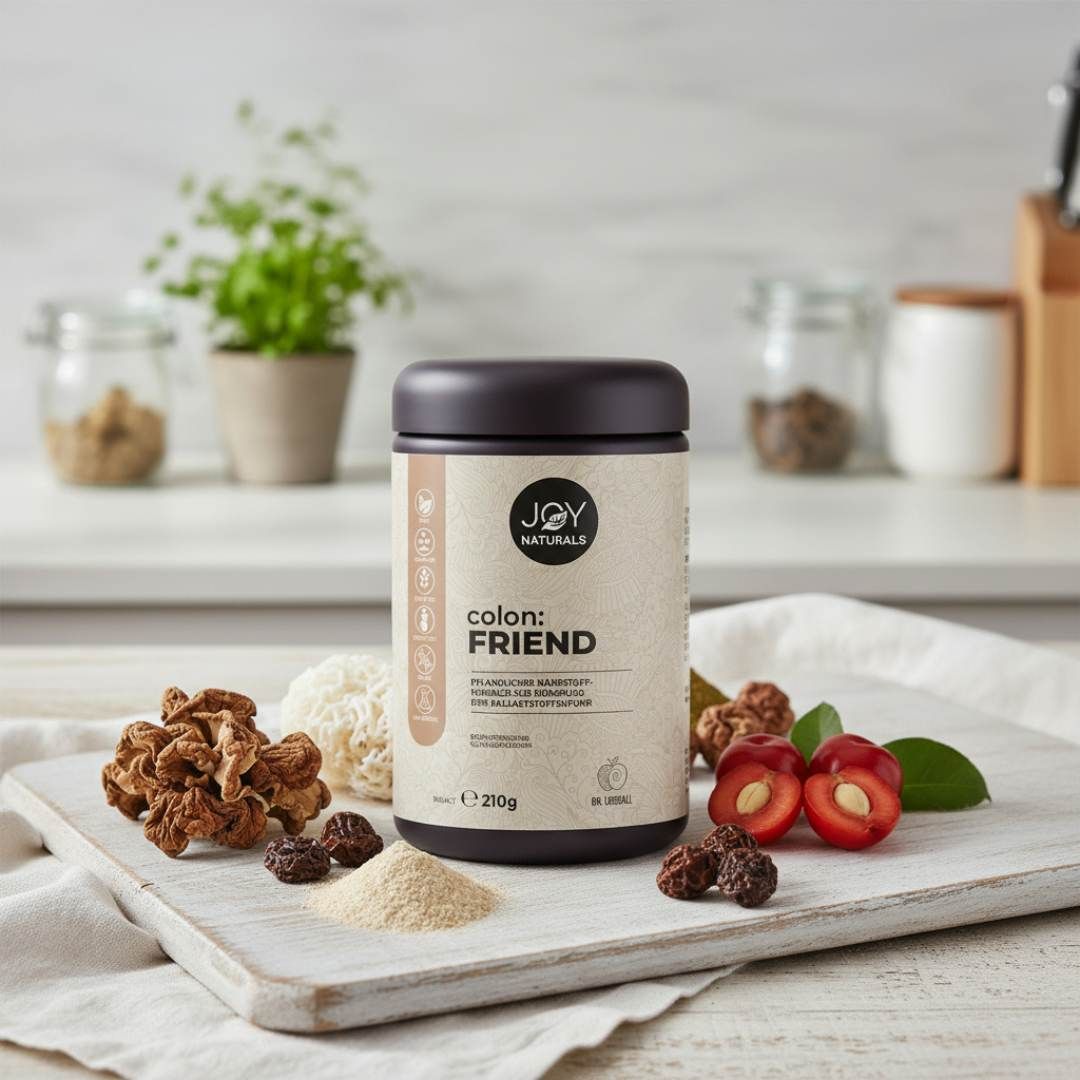 Barattolo JOY NATURALS colon:FRIEND. Coperchio marrone, etichetta beige. Su tagliere con frutta e ingredienti. 210g.