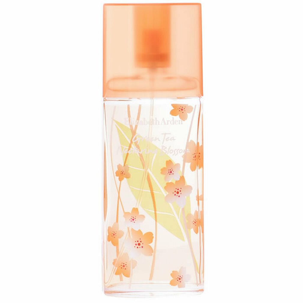Flacone rettangolare con tappo arancione. Motivi floreali e foglie verdi. Testo: Green Tea Nectarine Blossom.