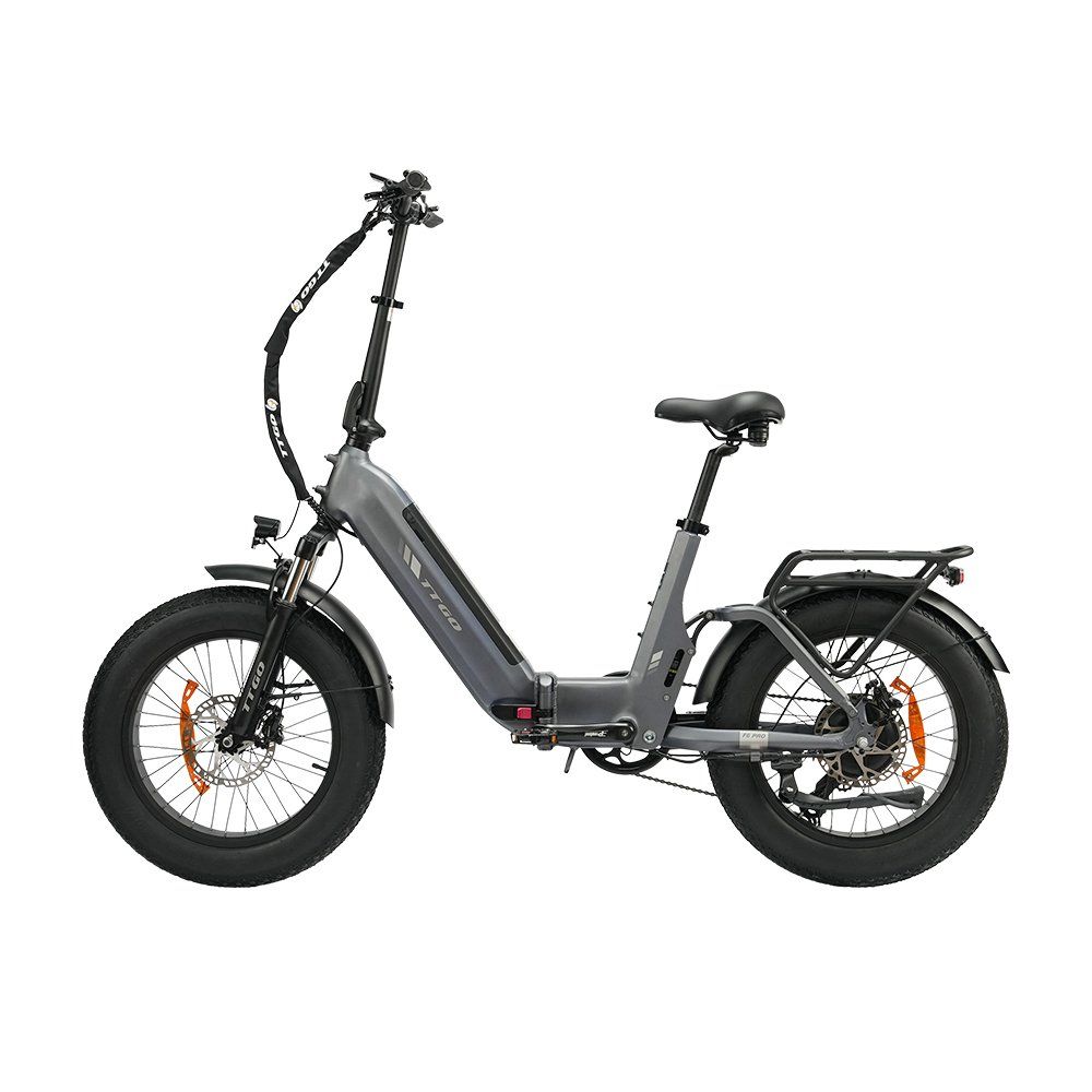 E-bike pieghevole grigia con pneumatici neri e dettagli arancioni. Dotata di portapacchi e freni a disco idraulici.