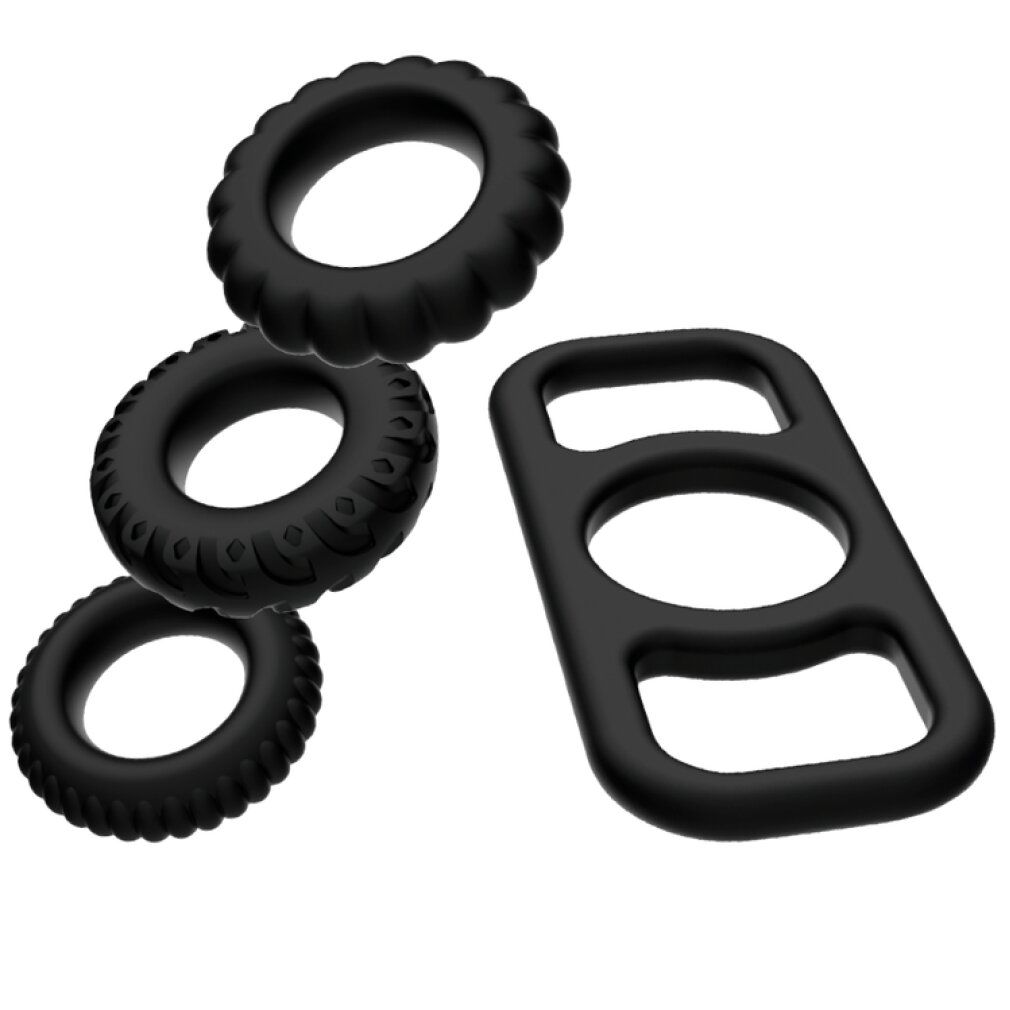 Quattro anelli per il pene neri in silicone. Tre con diverse trame, uno con tre aperture.