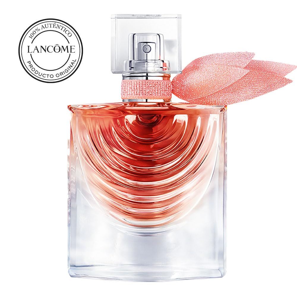 Flacone quadrato in vetro con liquido rosa. Vaporizzatore argentato, ornamento rosa e fiocco rosa. Testo: Lancôme, 100% autentico.