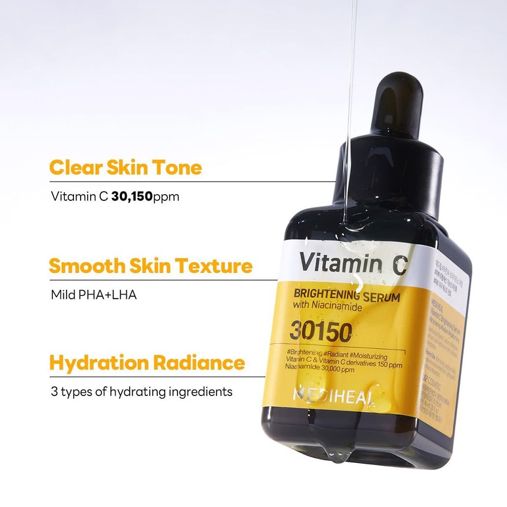 Flacone di siero con tappo nero. Etichetta gialla con testo: Vitamin C, 30150. Goccia di siero.