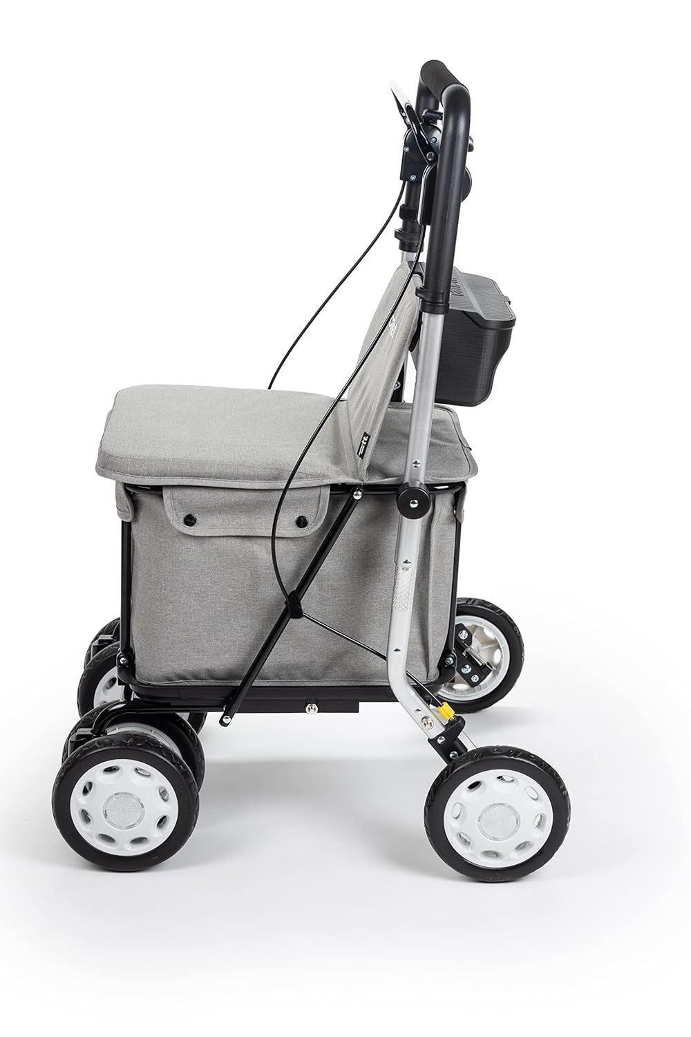 Vista laterale di un rollator grigio con sedile, borsa della spesa, quattro ruote e maniglia.