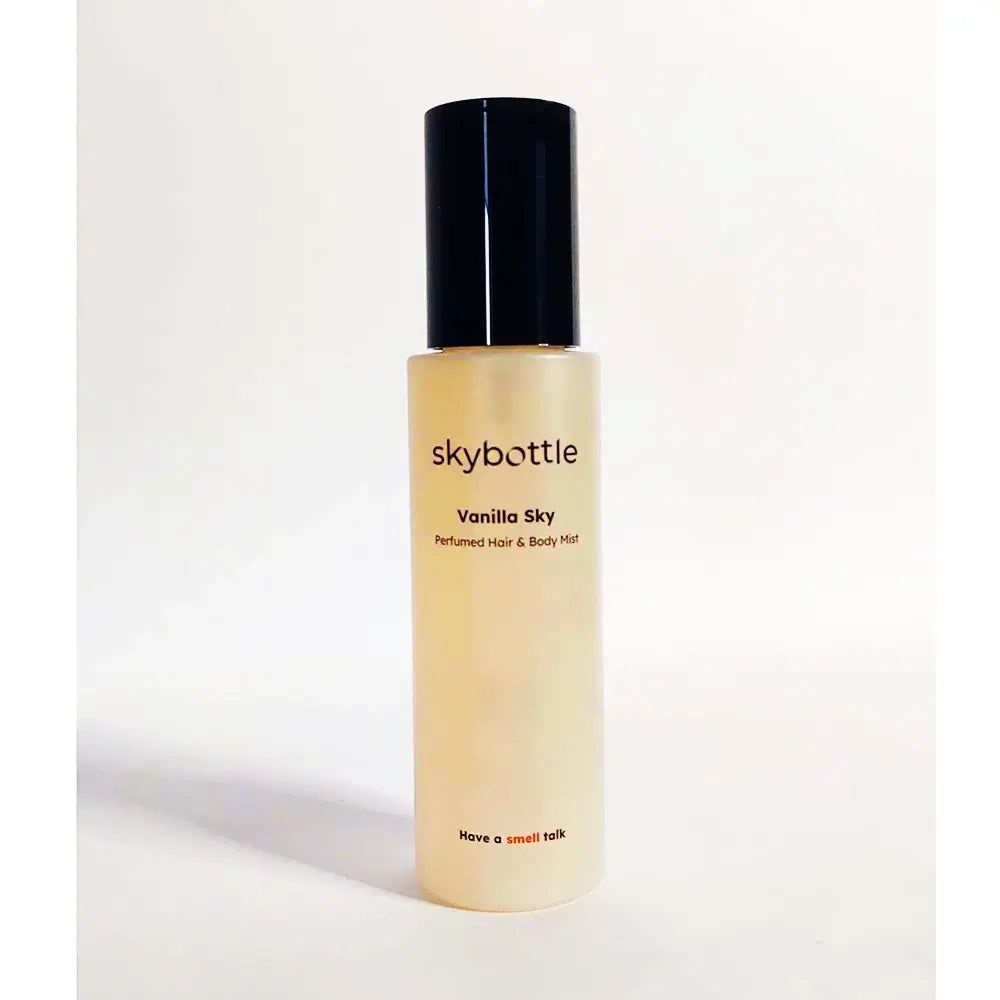 SKYBOTTLE Vanilla Sky, profumo per capelli e corpo. Flacone cilindrico con tappo nero. Scritta: Have a small talk.