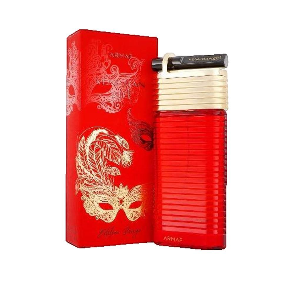 Flacone rosso con tappo dorato e chiusura nera. Confezione rossa con illustrazioni di maschere dorate e testo.