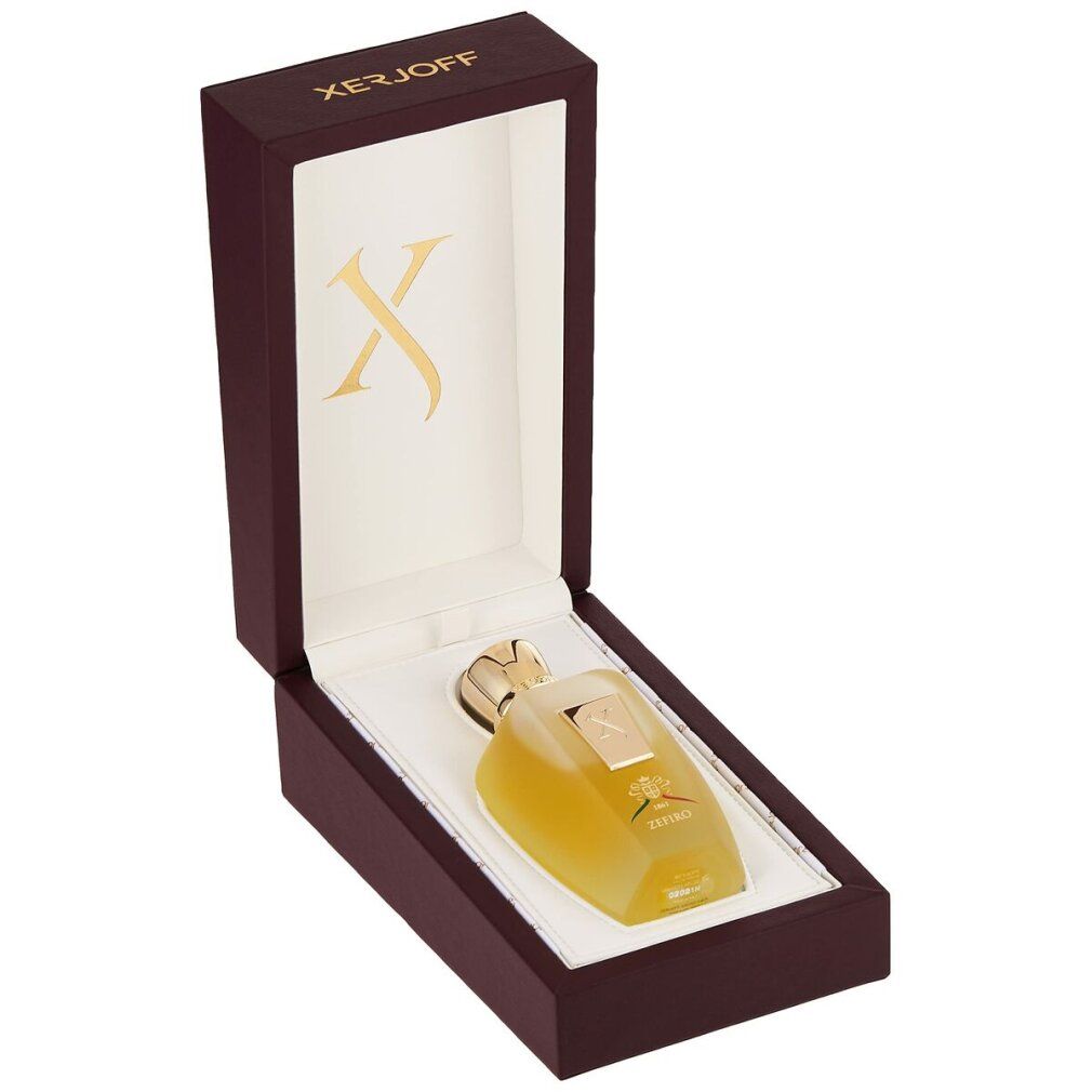 Flacone di profumo in una scatola marrone aperta. Tappo dorato ed etichetta 'X'. Interno foderato bianco.