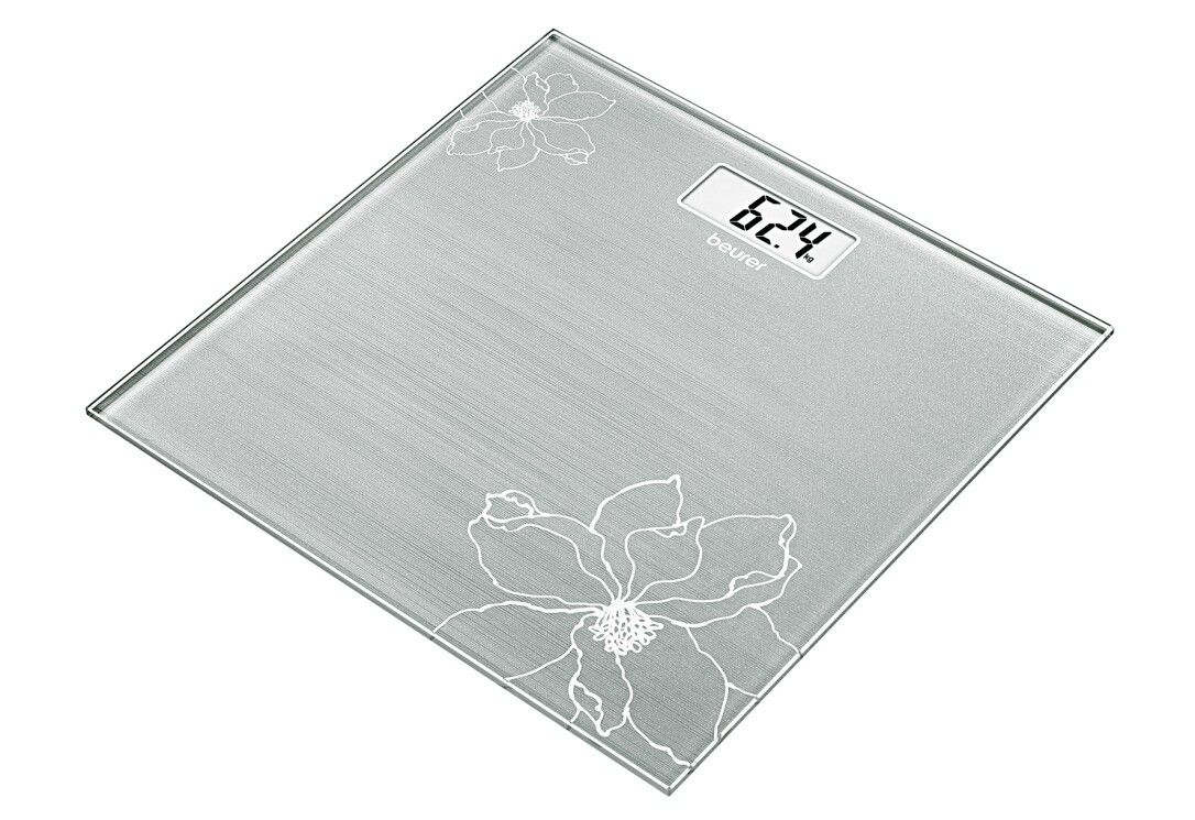 Bilancia in vetro con motivo floreale. Display digitale con peso. Marchio Beurer. Forma quadrata, vetro argentato.