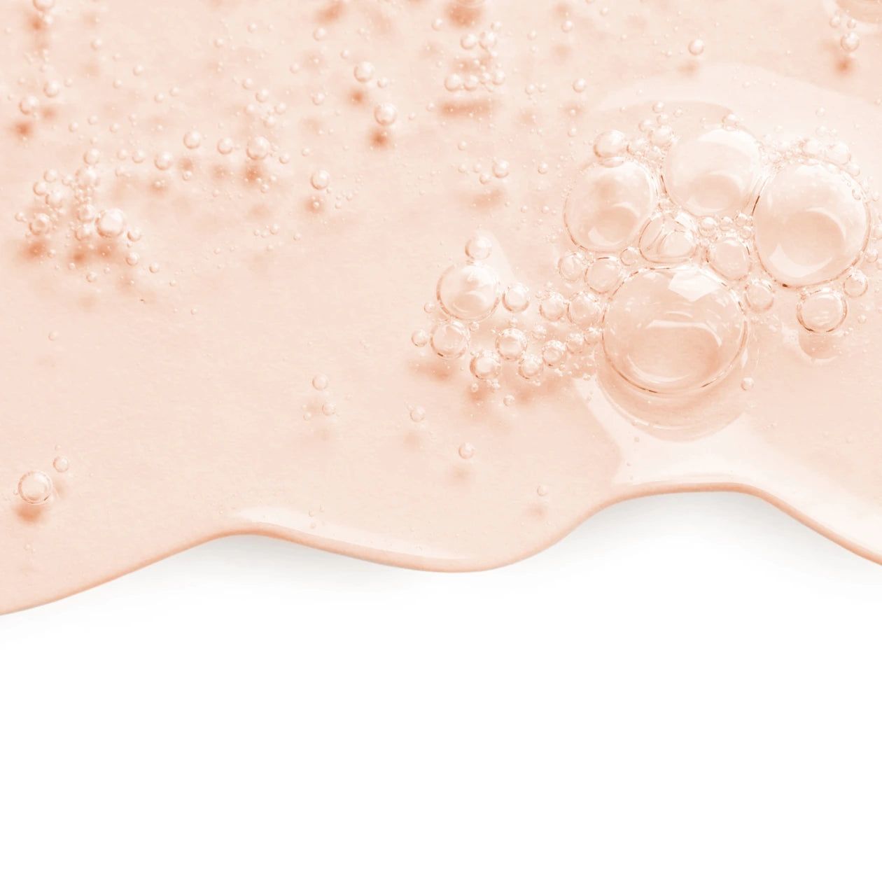 Primo piano di gel rosa con bolle. Su sfondo bianco.