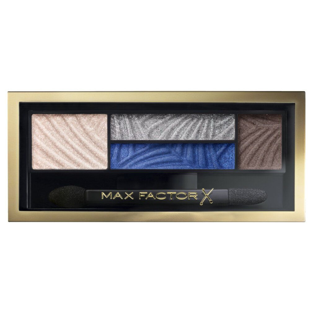 Palette ombretti con cinque colori, blu e marrone. Cornice dorata, applicatore nero. Scritta: MAX FACTOR.