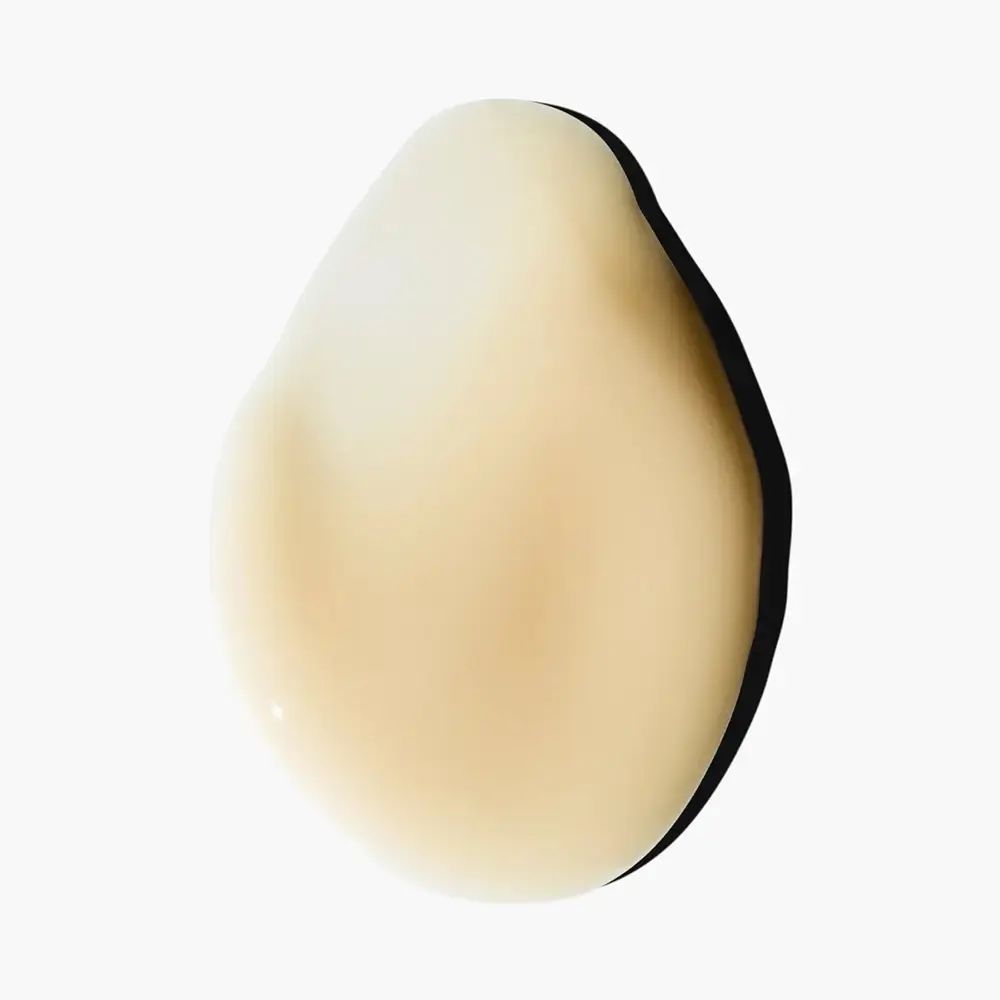 Goccia di siero beige, forma ovale. Ombra nera.