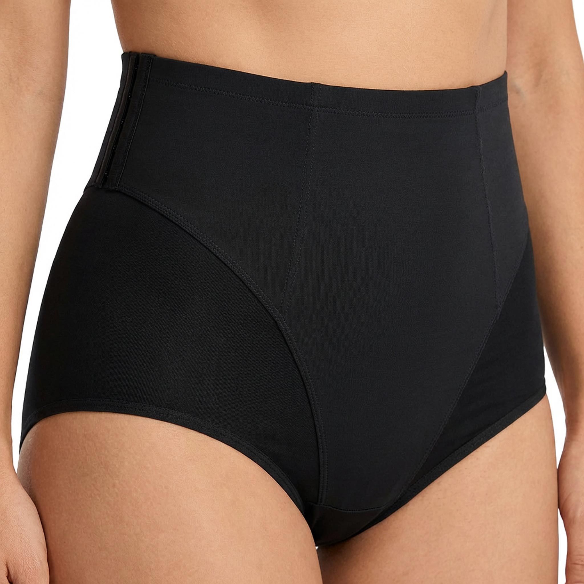 Guaina nera, vita alta, inserti laterali. Vista frontale, indossata da una persona.