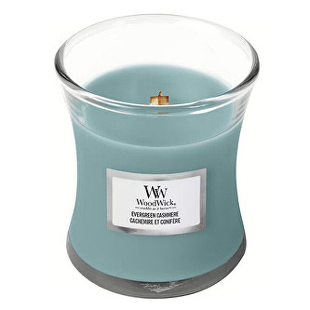 Contenitore di vetro con candela azzurra. Stoppino in legno. Etichetta con testo. Logo WW. Evergreen Cashmere. Cèdre et Conifère.