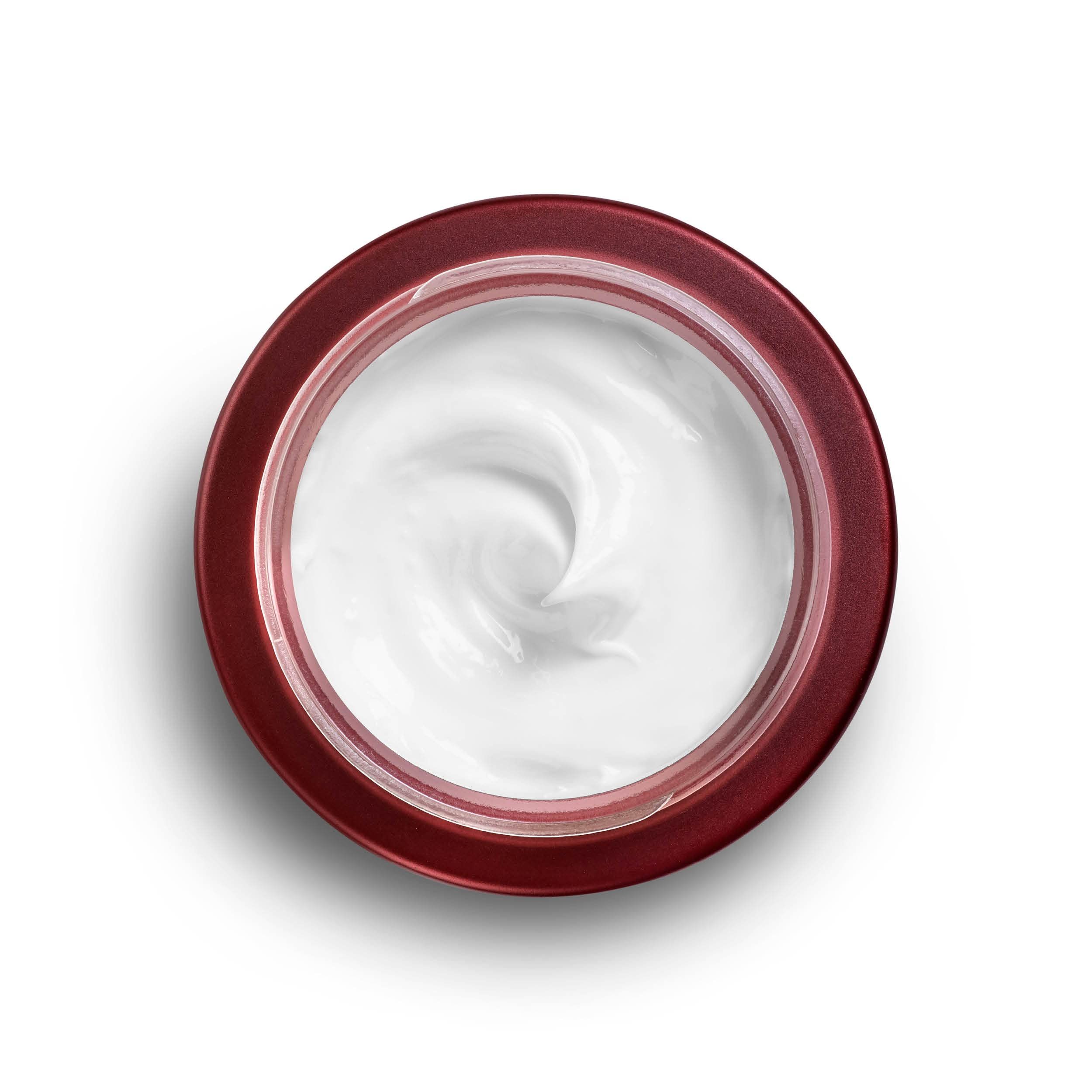 Maschera viso AHAVA aperta. Vasetto rosso, crema bianca, vista dall'alto.