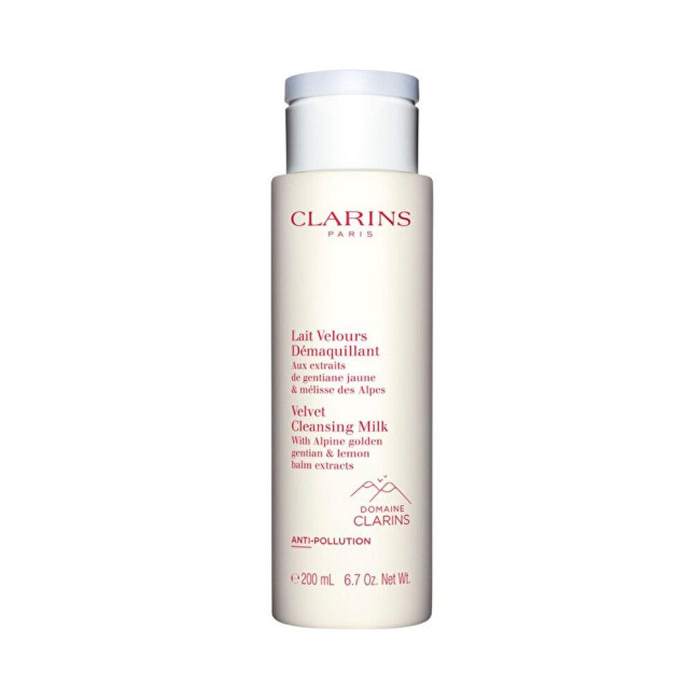 Flacone bianco con testo rosso. Contiene Lait Velours Démaquillant. Marchio Clarins. Ingredienti e logo visibili.