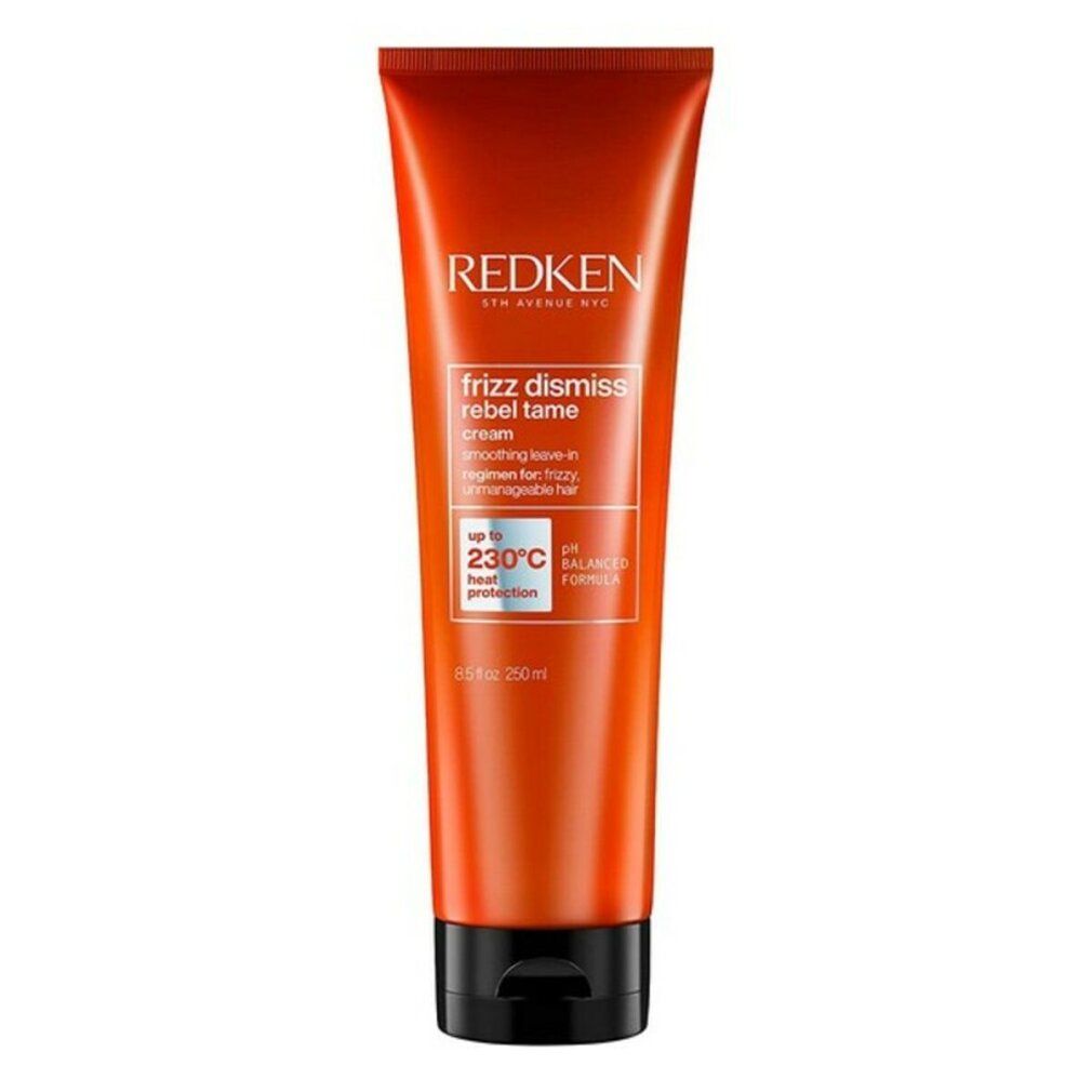 Tubo arancione con tappo nero. Scritta: Redken Frizz Dismiss Rebel Tame. Protezione termica 230°C.