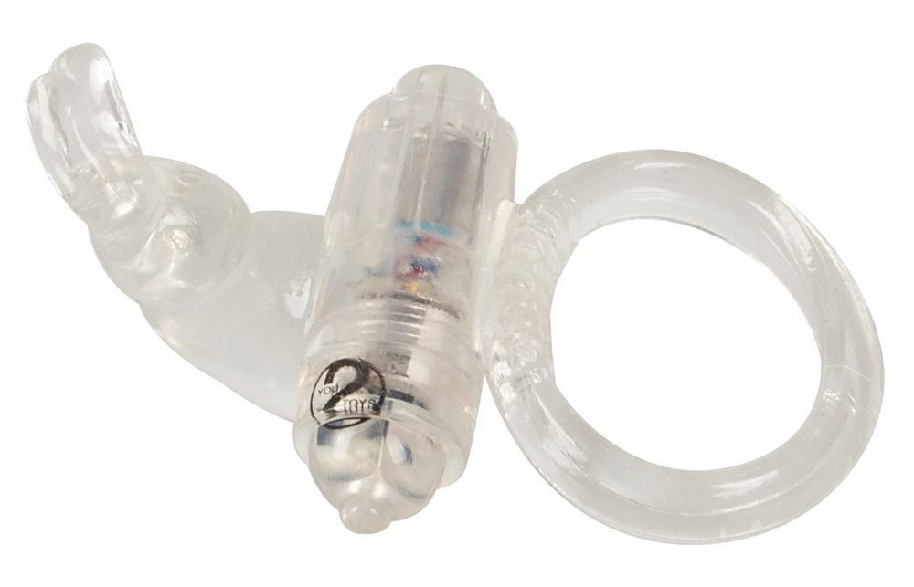 Anello vibrante trasparente con scanalature e un accessorio cilindrico contenente una batteria.