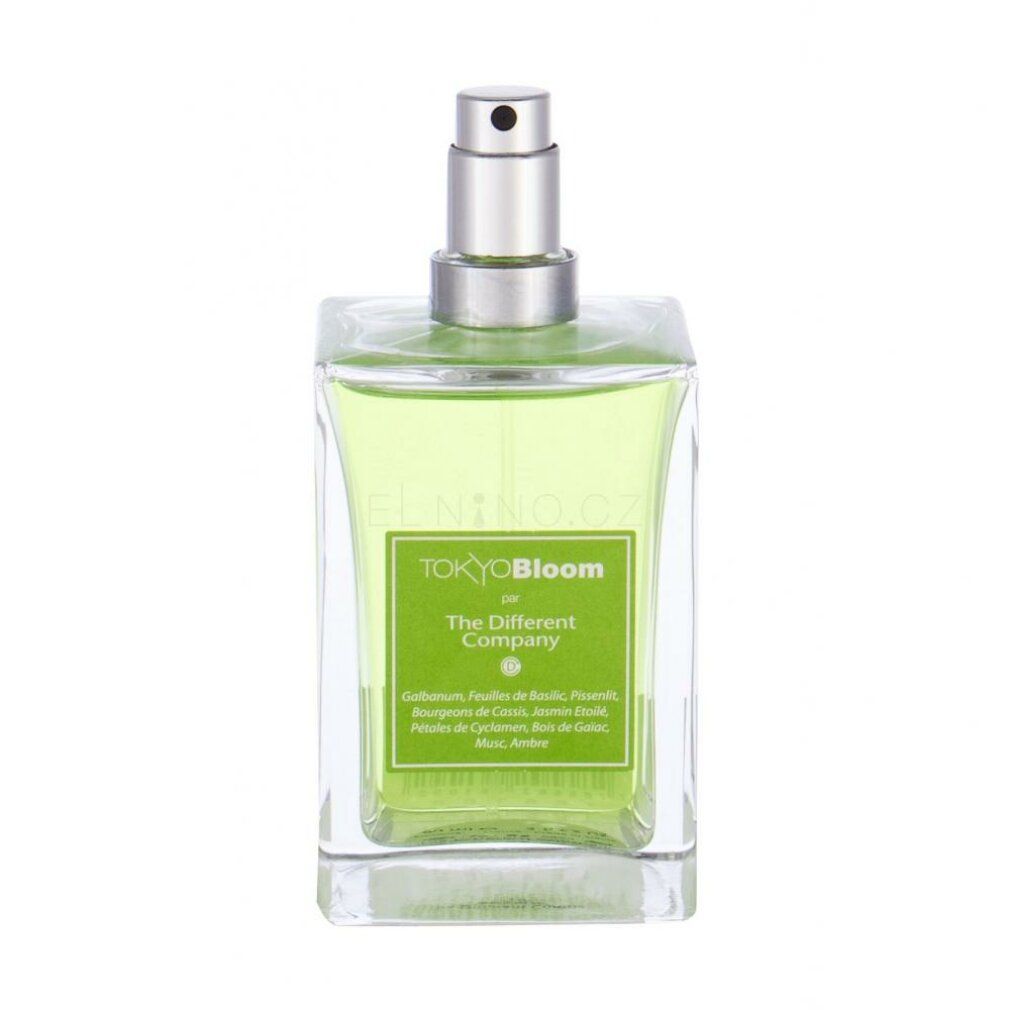 Flacone in vetro verde con vaporizzatore argentato. Sull'etichetta è scritto "TOKYO BLOOM" e "The Different Company".