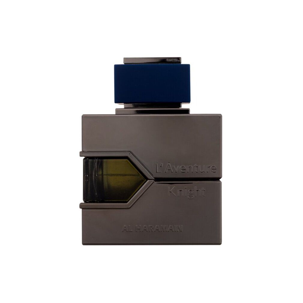 Flacone grigio scuro con tappo nero. Scritta: L'Aventure Knight, AL HARAMAIN. Forma rettangolare.