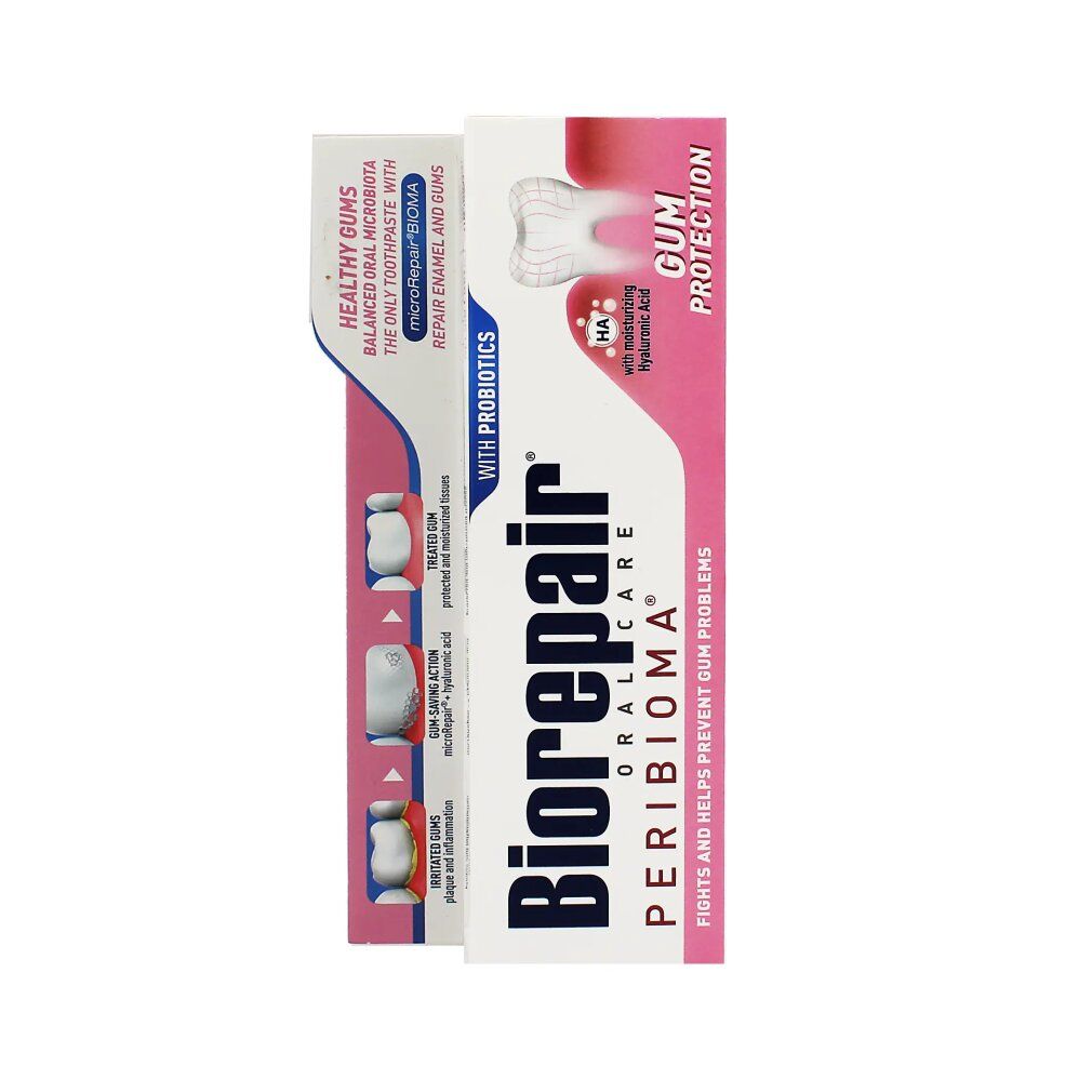 Confezione di dentifricio. Nome e logo del prodotto. Colori rosa e bianco. Testo: Protezione gengive, con probiotici, acido ialuronico.