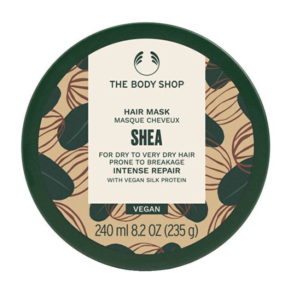 Barattolo rotondo verde con SHEA Hair Mask. Contiene 240 ml. Vegano. Logo The Body Shop. Scritta: Intense Repair.