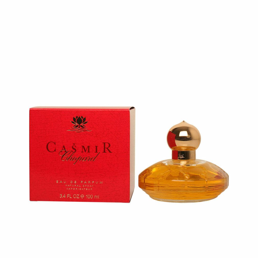 Flacone di profumo giallo con tappo dorato e confezione rossa. Scritta: Casmir Chopard.