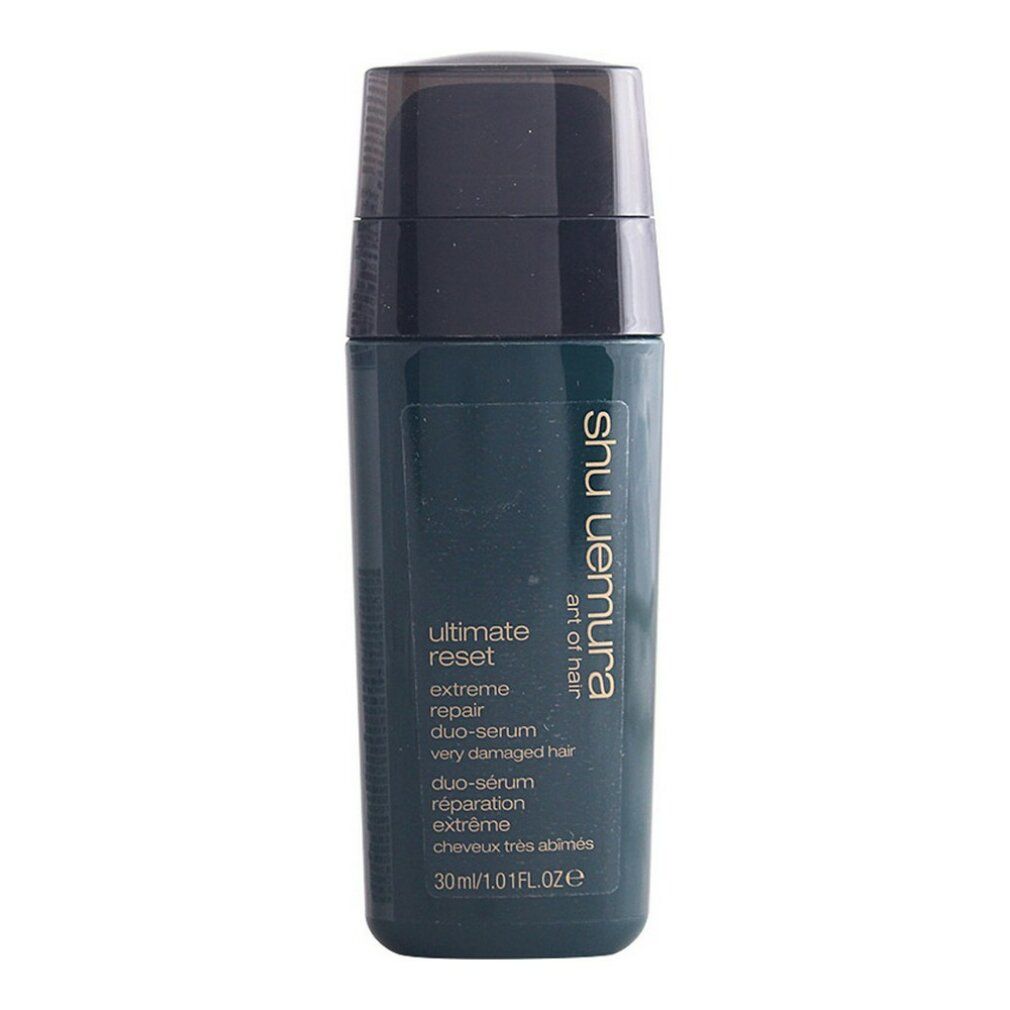 Flacone verde scuro con tappo nero. Scritta: Ultimate Reset Duo-Serum, riparazione estrema, capelli molto danneggiati. Marchio: Shu Uemura.
