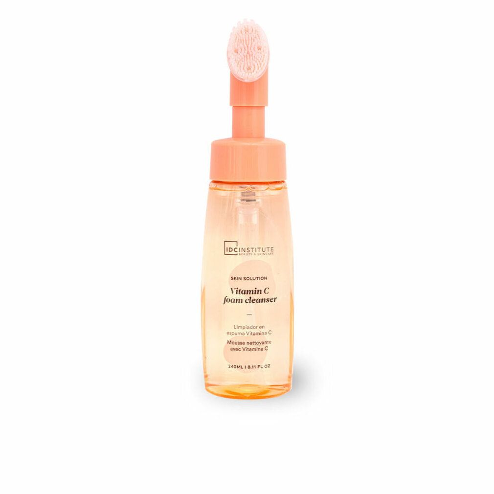 Flacone trasparente con erogatore e spazzola arancioni. Scritta: IDC INSTITUTE, Vitamin C foam cleanser.
