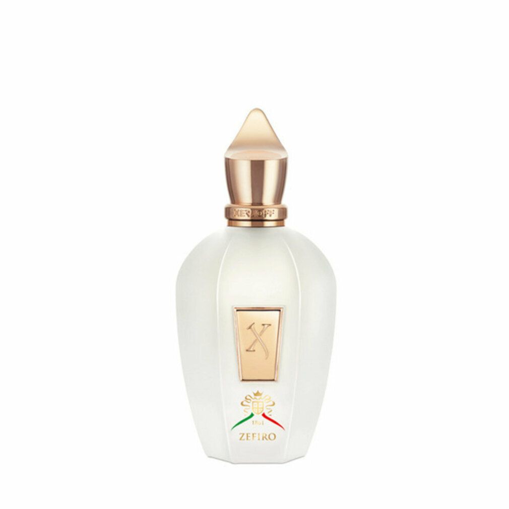 Flacone di profumo bianco con tappo dorato ed etichetta quadrata 'X'. Sotto 'ZEFIRO' e bandiera italiana.