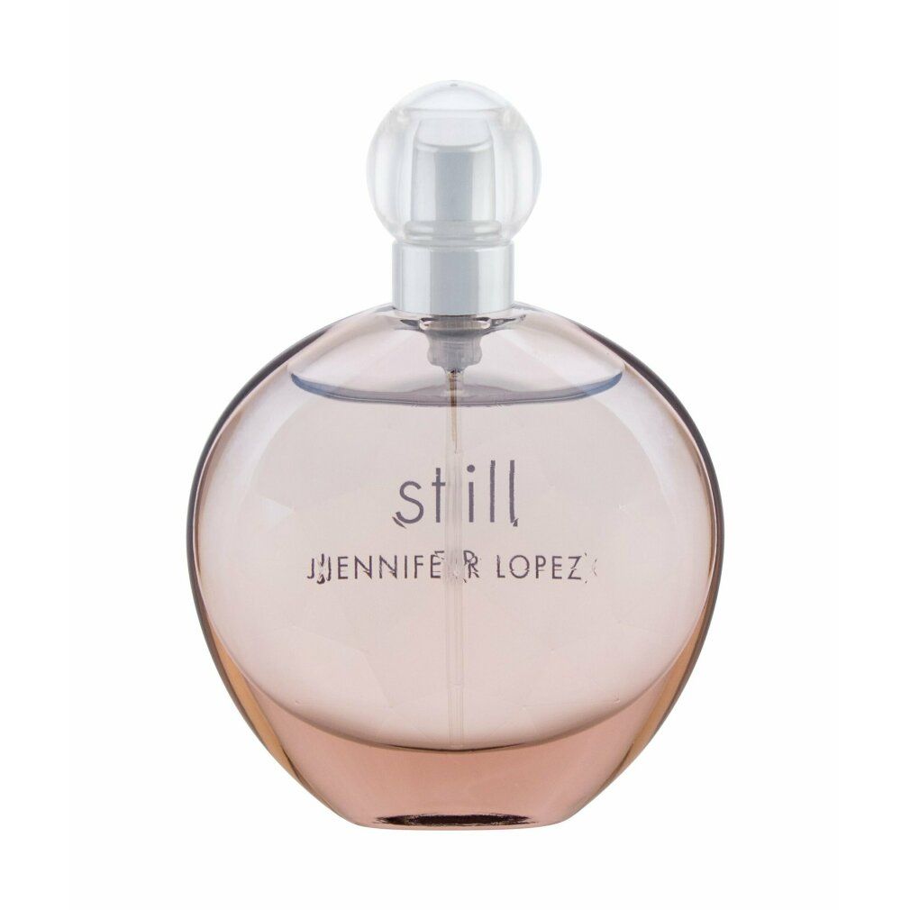 Flacone di profumo rotondo, marrone chiaro. Scritta "still jennifer lopez". Chiusura trasparente.