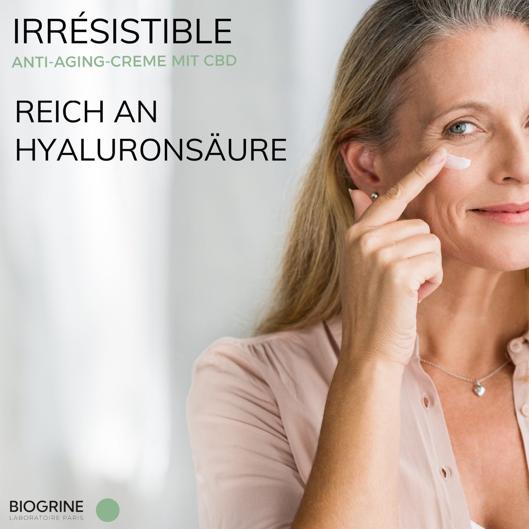 Donna applica crema. Testo: „IRRESISTIBLE“ crema anti-età con CBD. Ricca di acido ialuronico. BIOGRINE.
