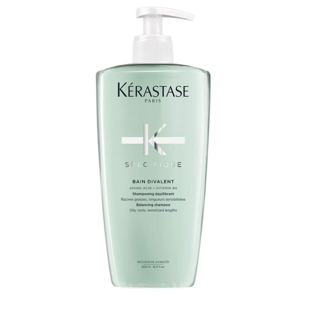Flacone verde chiaro con dosatore bianco. Testo: Kérastase, Spécifique, Bain Divalent, Shampooing équilibrant. Per radici grasse, lunghezze sensibilizzate.