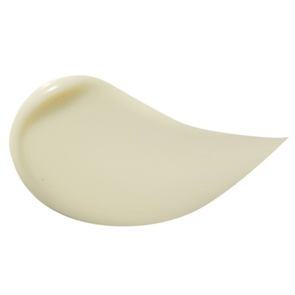 Primo piano di una macchia di crema beige. Forma liscia e curva. Nessun altro dettaglio visibile.