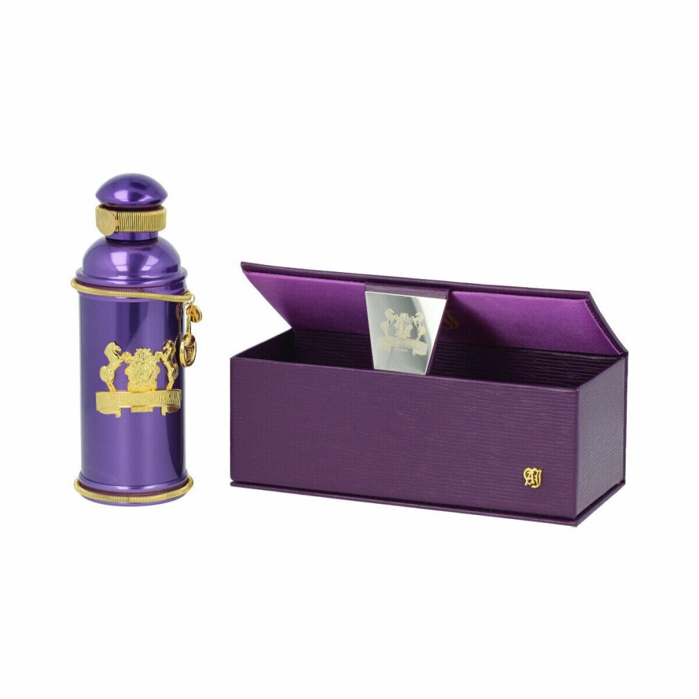 Flacone di profumo viola accanto a scatola viola aperta. Ornamenti dorati. Logo sulla scatola.