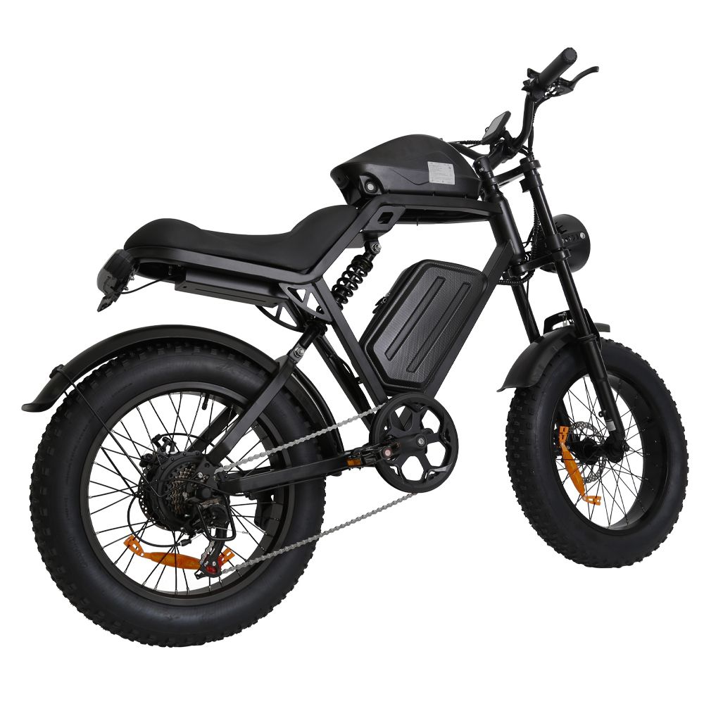 E-bike nera con pneumatici larghi. Vista laterale, mostra sella, batteria e trasmissione.