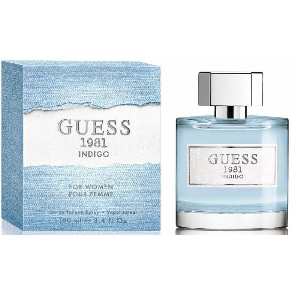 Flacone di profumo blu e scatola. Scritta: GUESS 1981 INDIGO. Eau de Toilette Spray. Per donne. 100 ml.