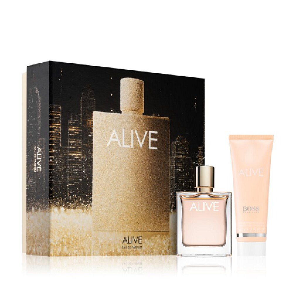 Set regalo con flacone di profumo, crema e scatola. Scritta "ALIVE" e "BOSS". Tonalità oro e nero.