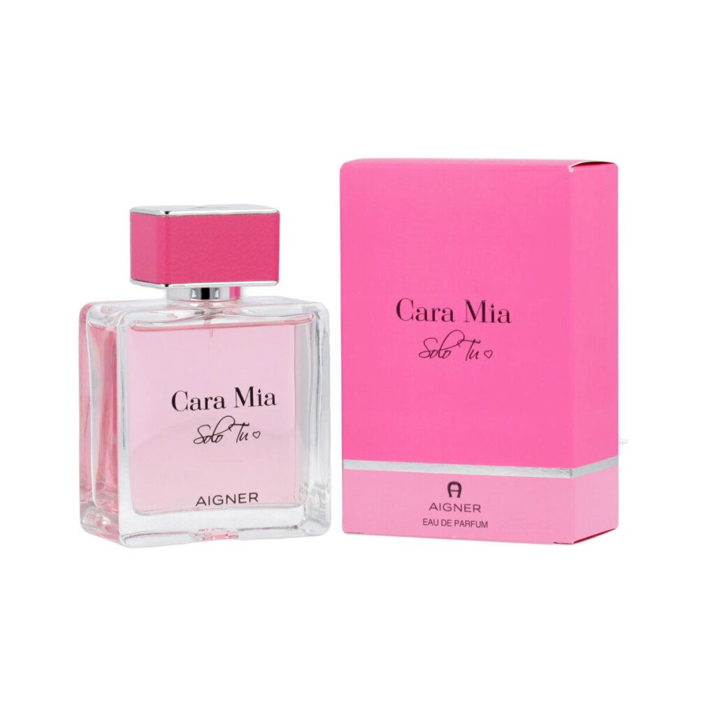 Flacone di vetro e confezione rosa. Flacone con liquido rosa, scritta 'Cara Mia Solo Tu' e 'AIGNER'.