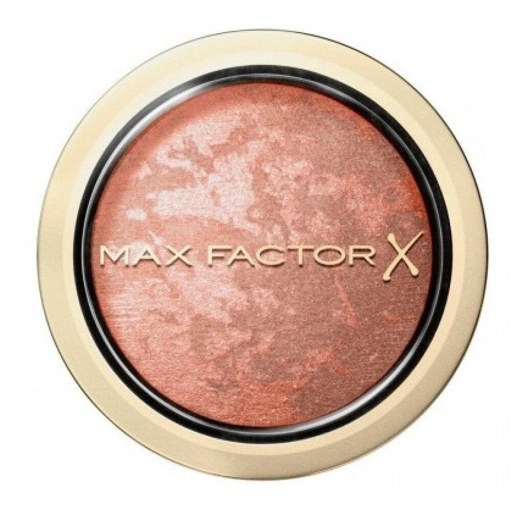 Fard Max Factor in confezione rotonda dorata, tonalità rosata marmorizzata.