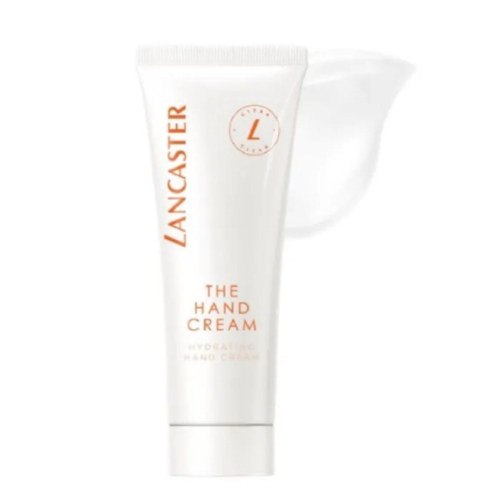 Tubo bianco con scritta "Lancaster The Hand Cream". Scritta arancione. Macchia di crema accanto.