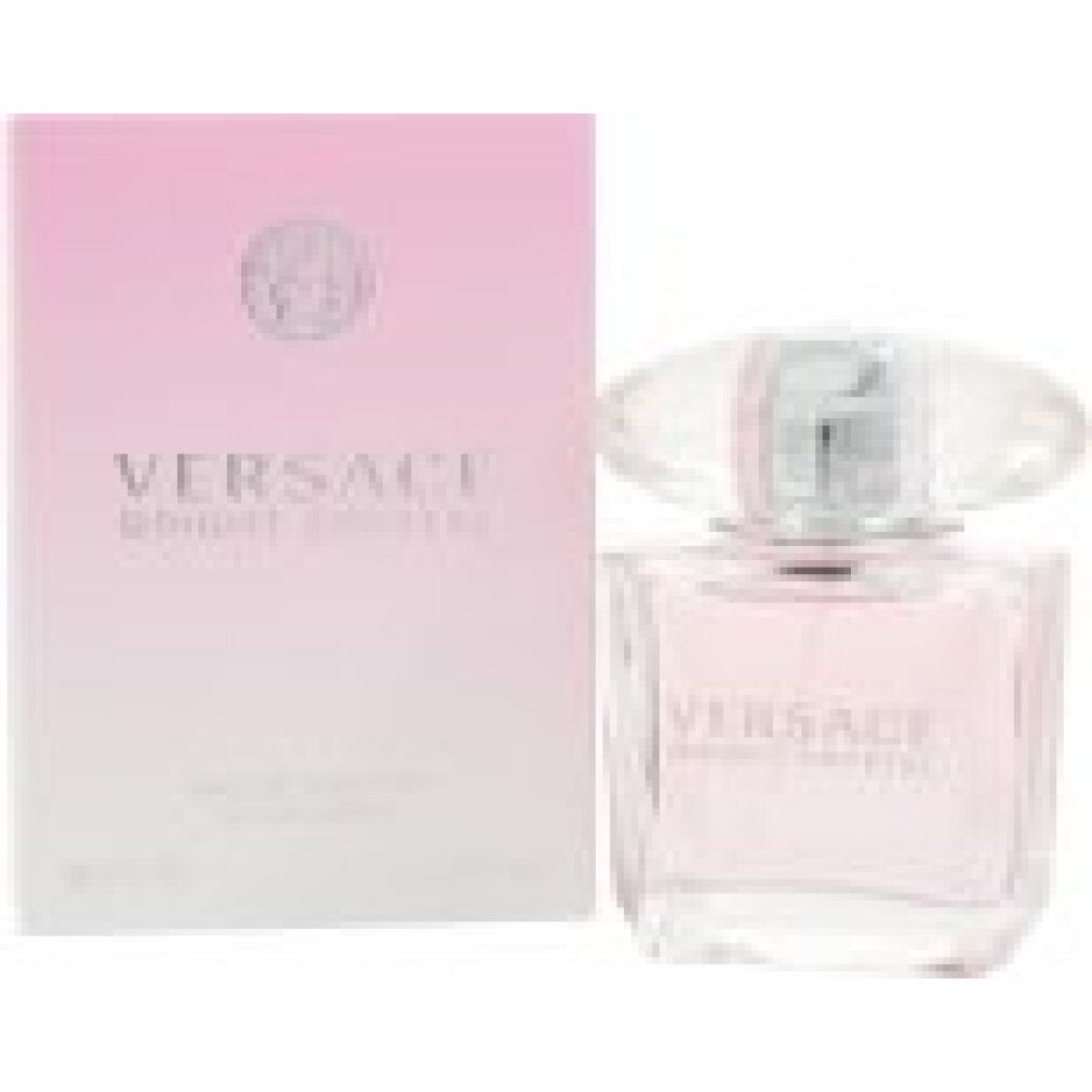Versace Bright Crystal Eau de Toilette Spray. Flacone e confezione rosa. Tappo di cristallo. Logo e testo.