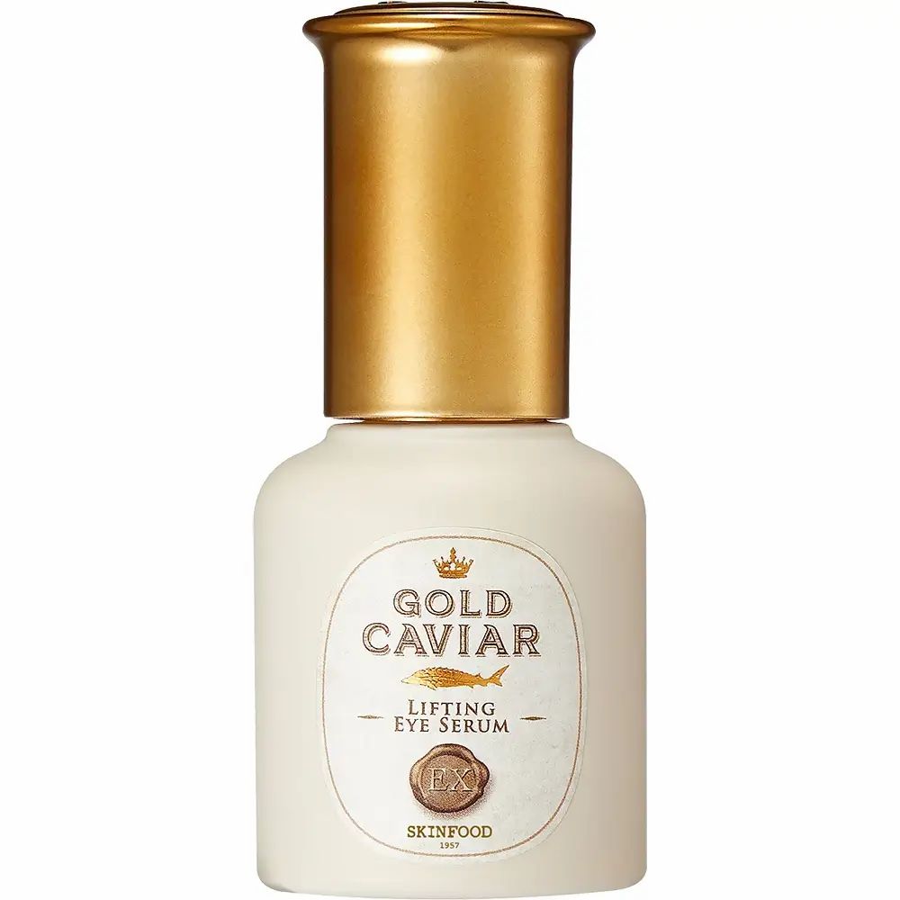 Flacone beige con tappo dorato. Scritta: Gold Caviar Lifting Eye Serum. Marchio: SKINFOOD.