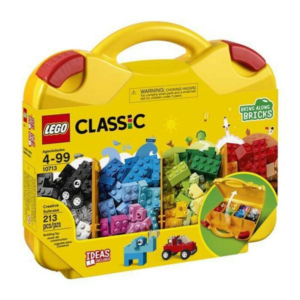 Valigetta gialla LEGO Classic con chiusure rosse. Contiene mattoncini colorati in scomparti. Scritta: LEGO CLASSIC, 4-99, 10713, 213 pezzi.