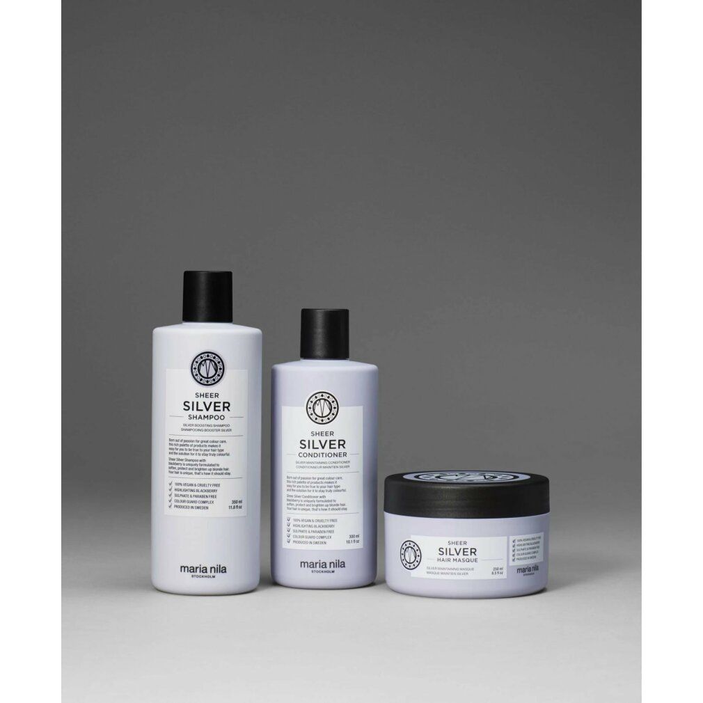 Tre prodotti Maria Nila: shampoo, balsamo e maschera per capelli. Tutti con tappo nero e scritta argento.