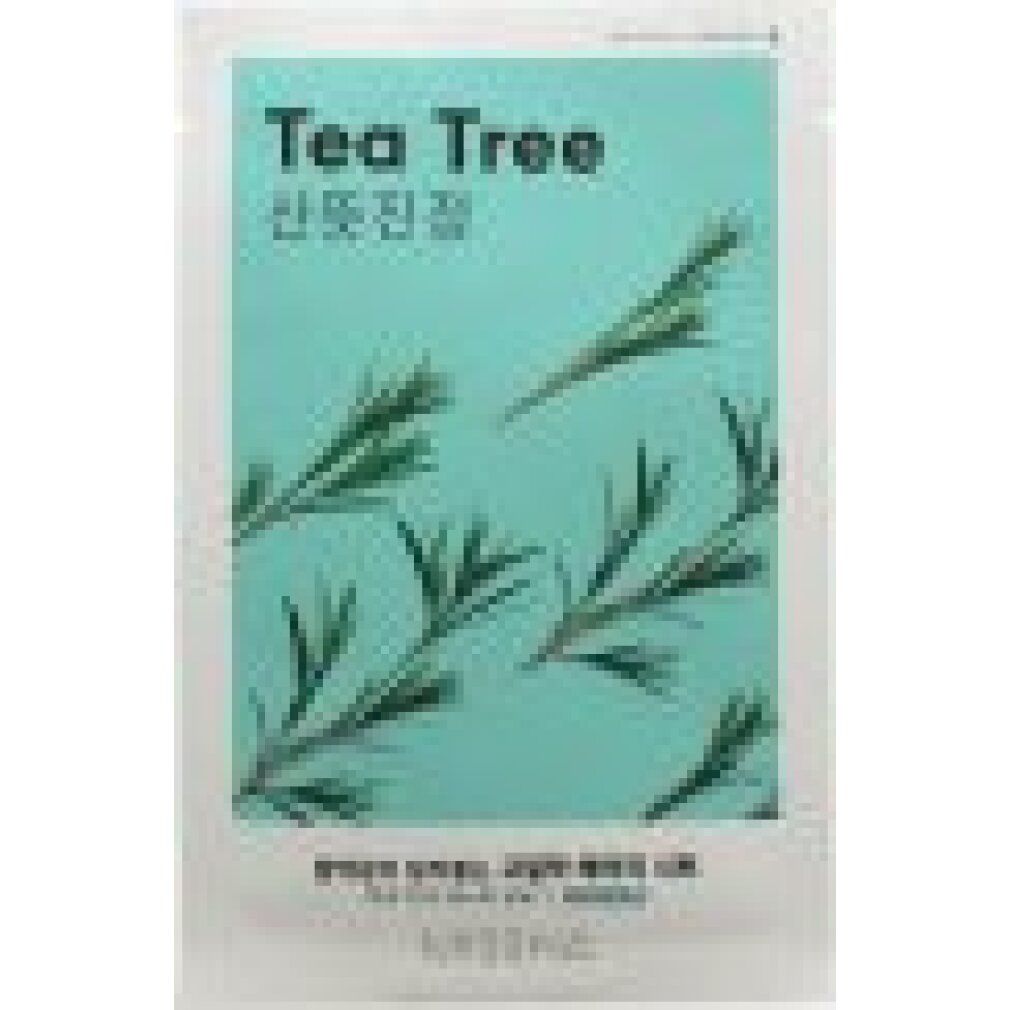 Confezione bianca con sfondo verde e motivo tea tree. Testo: Tea Tree, caratteri coreani. 