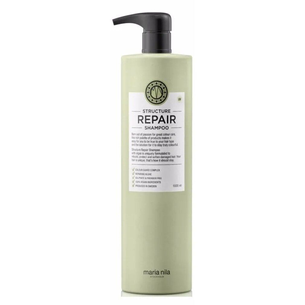 Flacone verde chiaro con dispenser nero. Etichetta "STRUCTURE REPAIR SHAMPOO" e "maria nila".