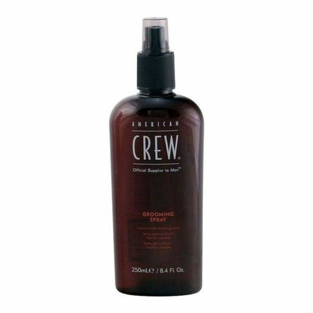 Flacone marrone con erogatore nero. Scritta: AMERICAN CREW GROOMING SPRAY. Volume: 250ml.